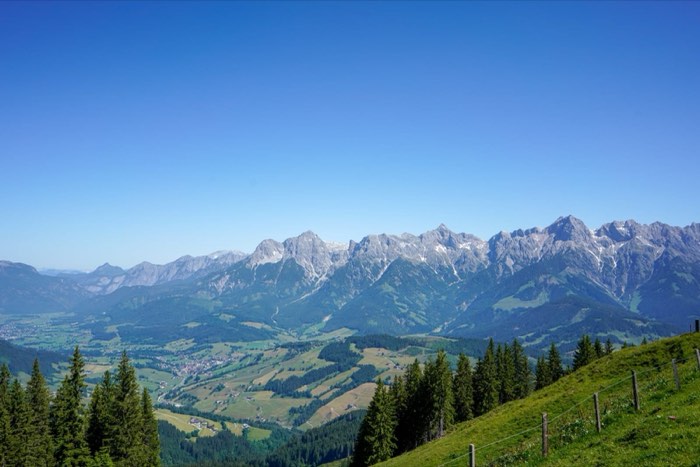 A limestone range above a valley of farms and pasture.