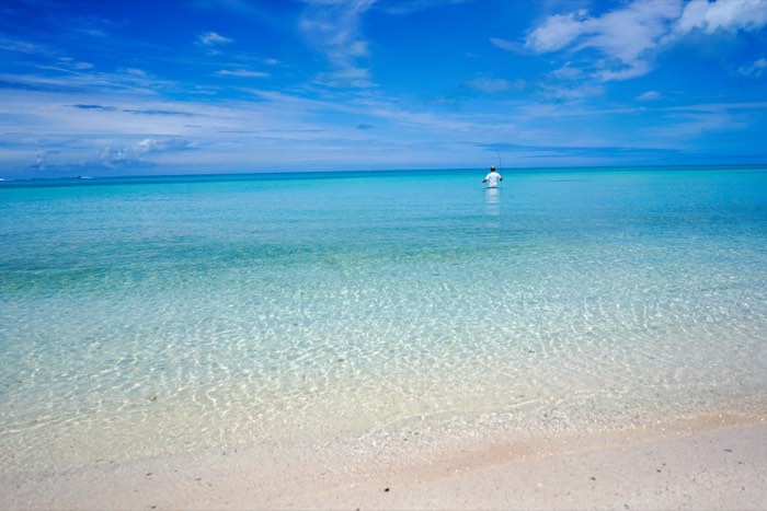 Clear water running out to the horizon.
