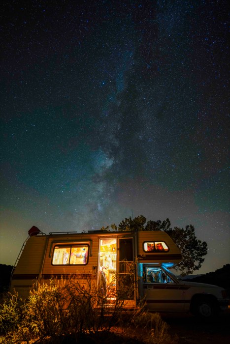 The Milky Way over a home on wheels.